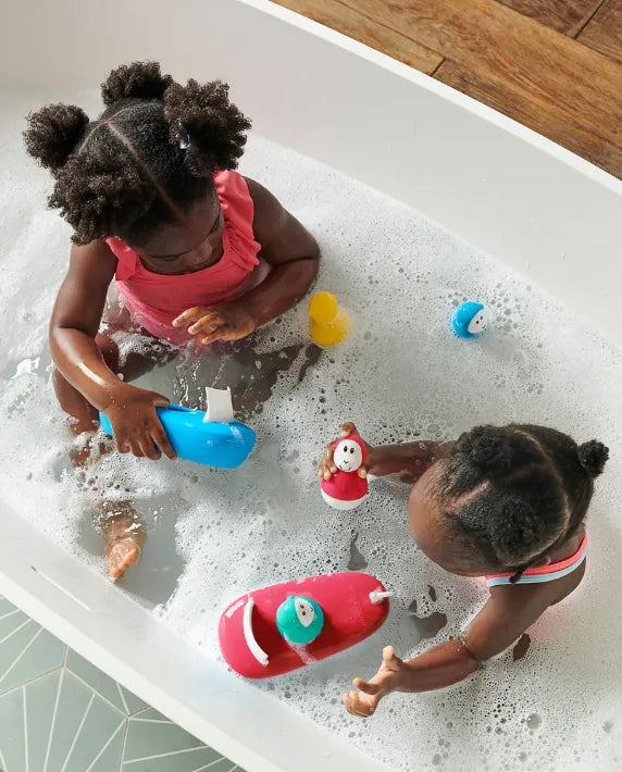 kids playing with matchstick monkey bath toys