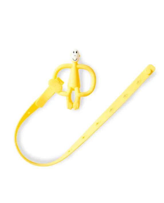 Matchstick Monkey Multi-Use Product Holder - Yellow silicone holder strap attached to baby accessories on pram or highchair