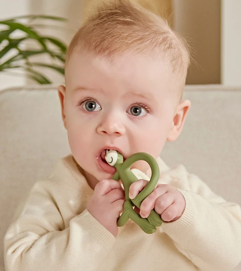 Baby chewing a Matchstick Monkey teether