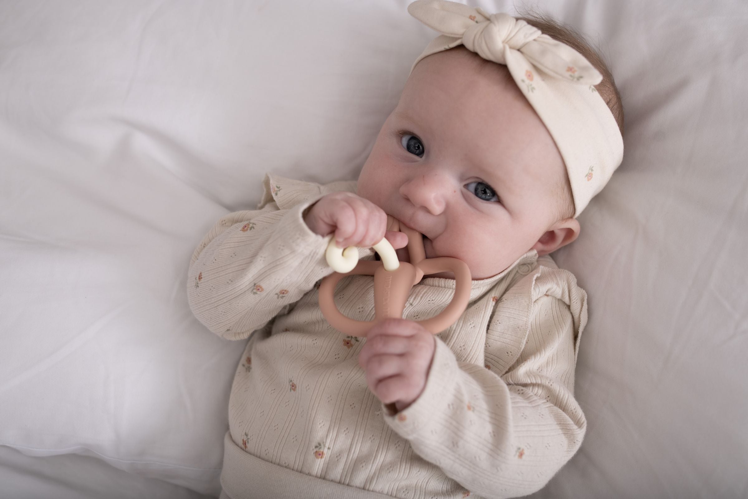 Baby chewing a Matchstick Monkey teether